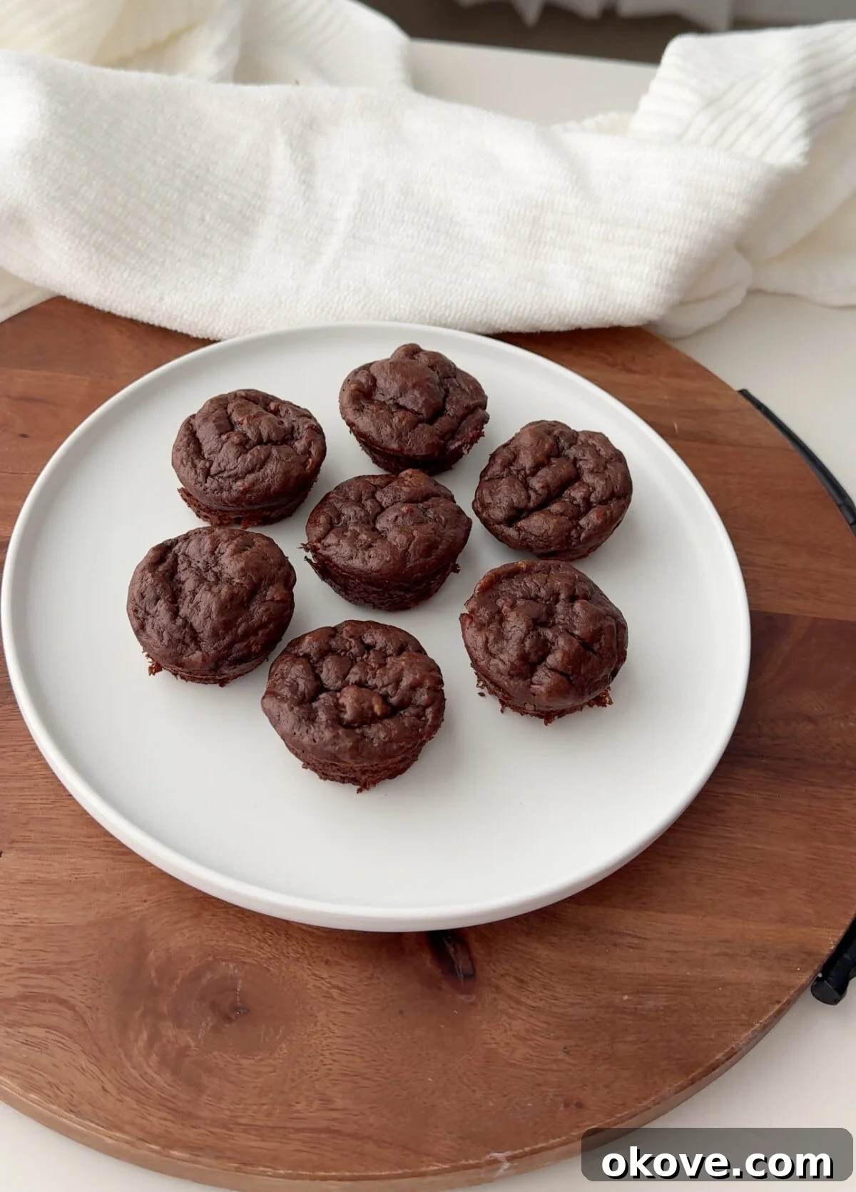 No Flour PB Chocolate Bites 2 Easy flour-free pb chocolate muffins on a white plate