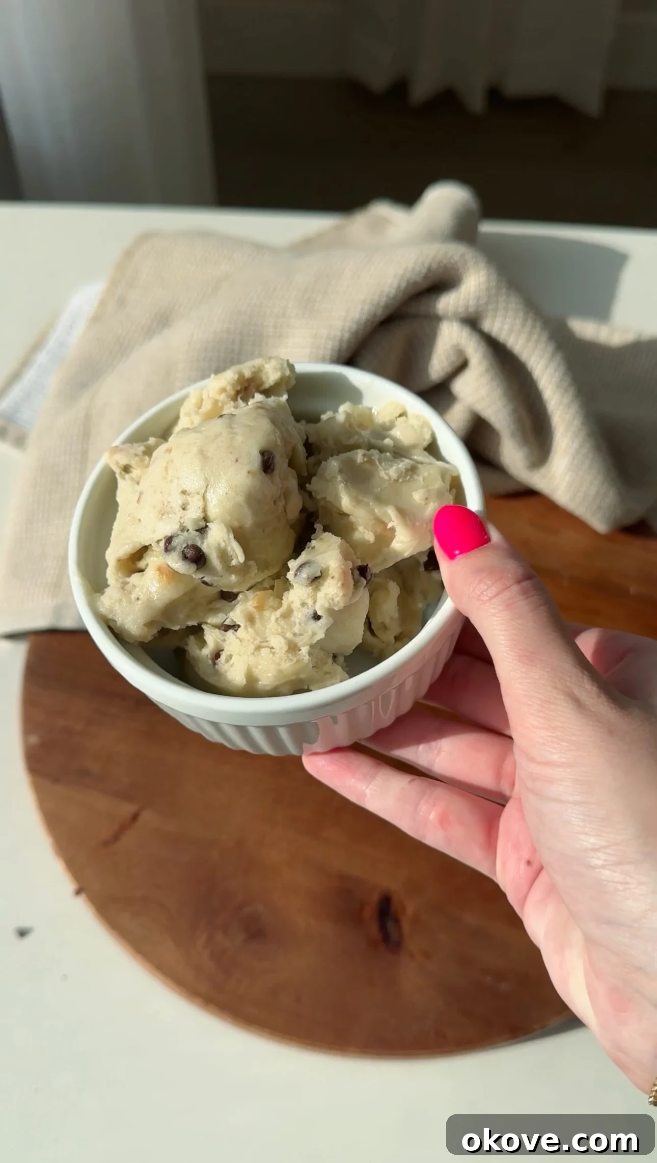 A bowl of creamy, healthy banana chocolate chip ice cream, garnished with a few extra chocolate chips, perfect for toddlers and kids.