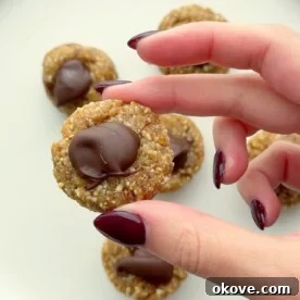A hand holding simple date bites