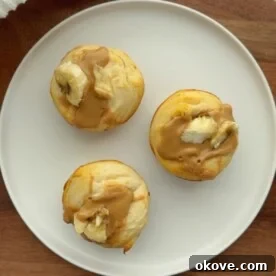 Three toddler-friendly Peanut Butter Banana Biscuits on a white plate