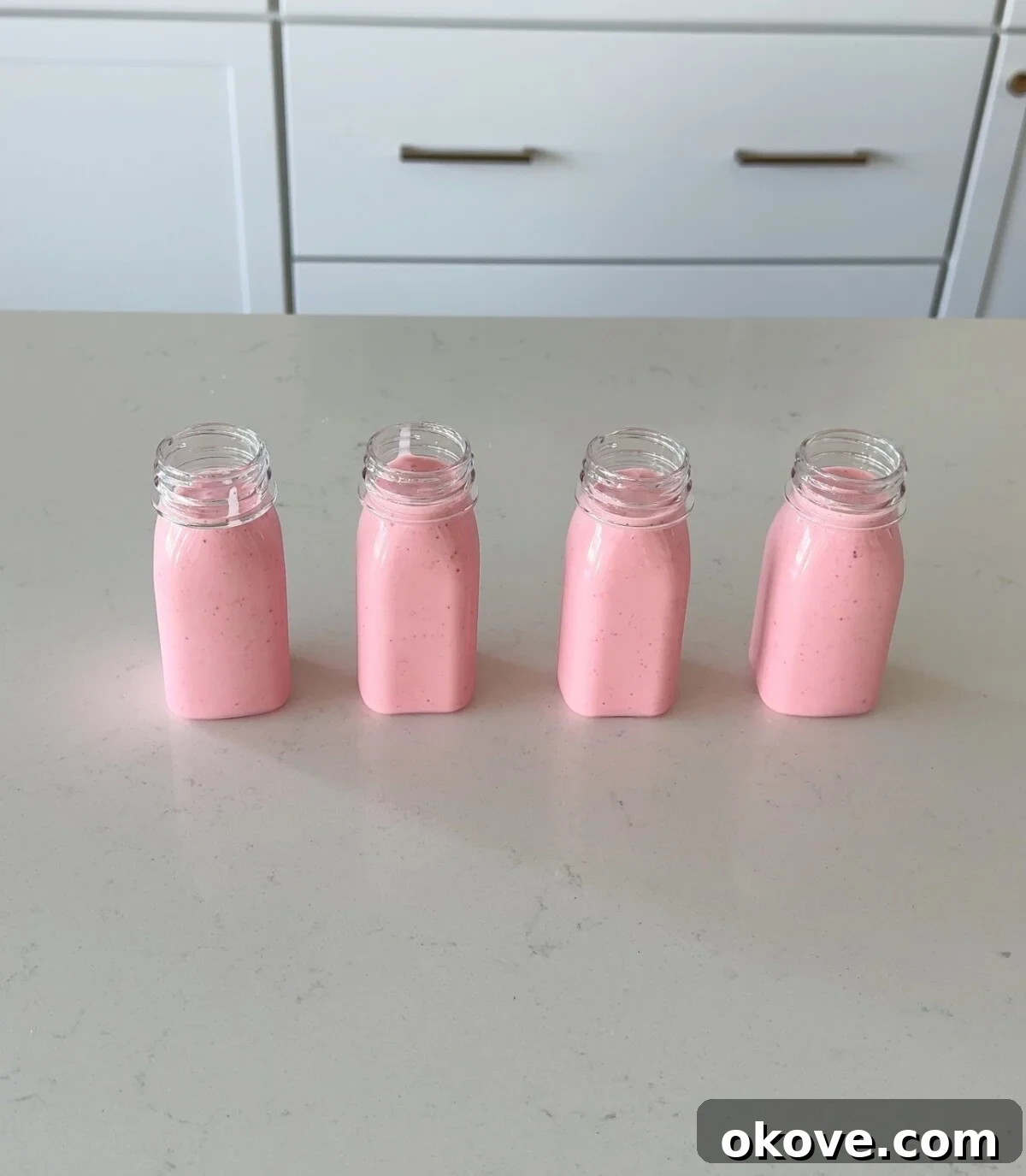 Easy drinkable strawberry yogurt in four cups