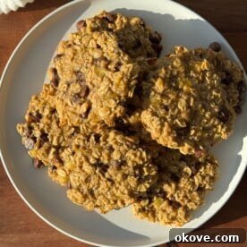 Chewy Banana Oat Chocolate Chip Cookies 3 Close-up of freshly baked banana oat chocolate chip cookies, stacked and ready to eat.