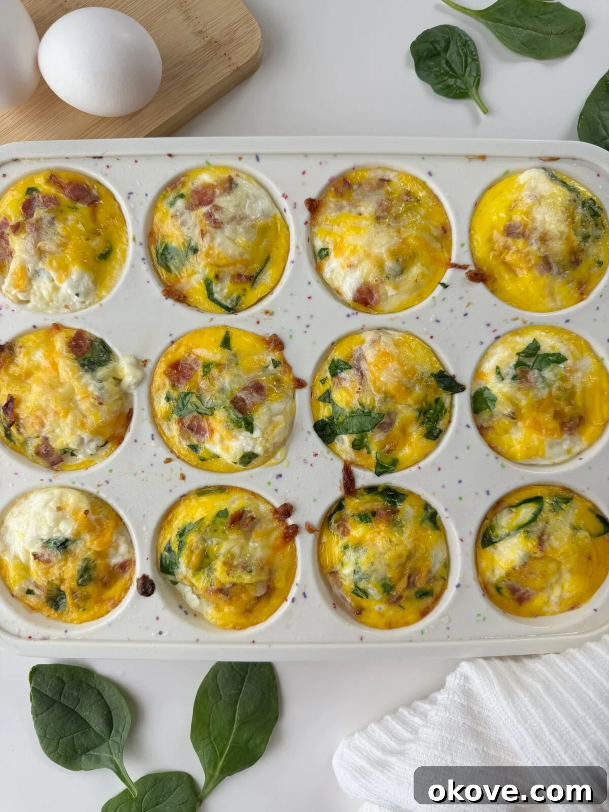 Two Protein Egg Muffins on a plate, showcasing their fluffy texture and delicious toppings, ready for a child to enjoy.