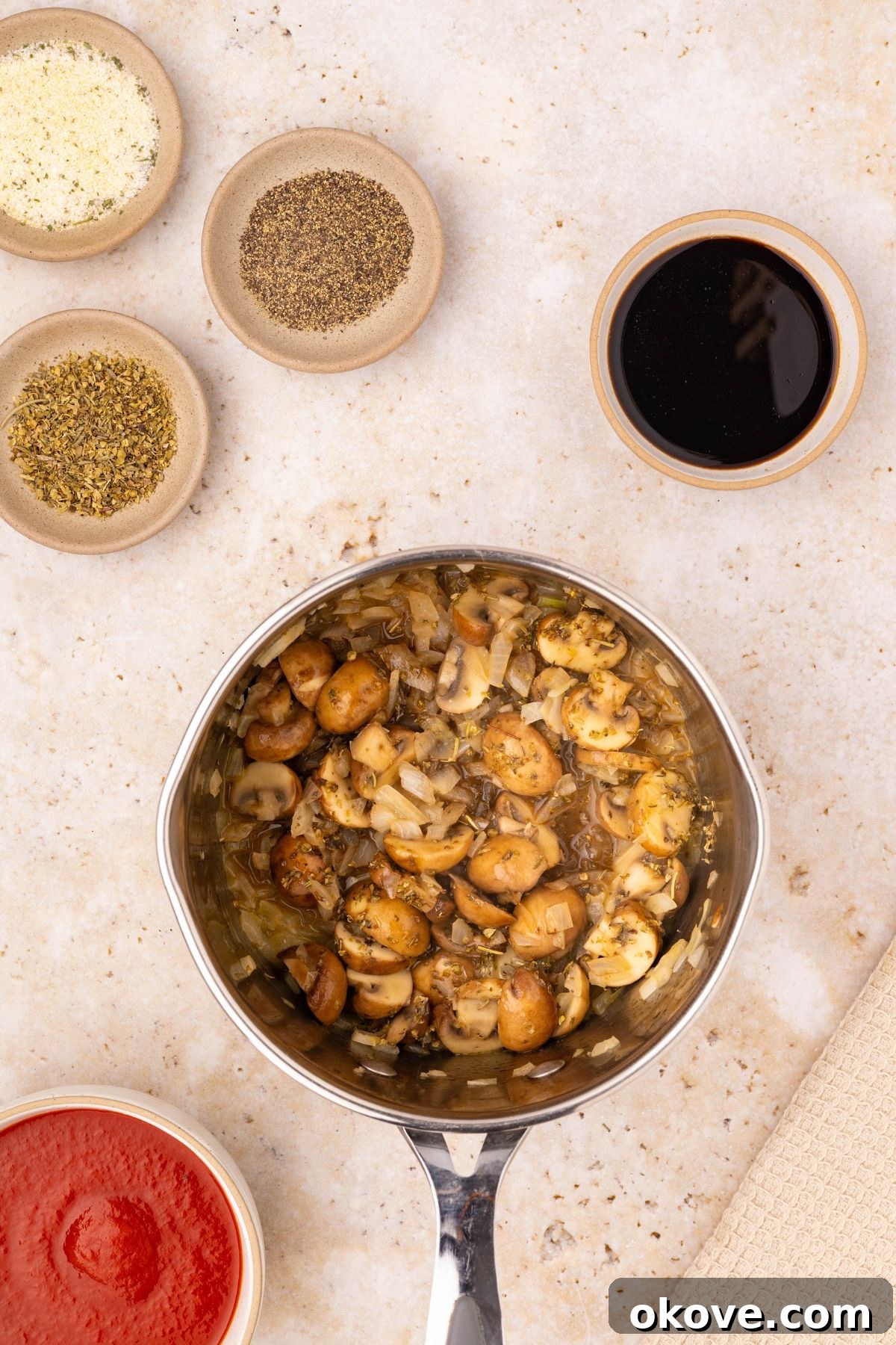 Classic Italian Meatloaf 5 Diced mushrooms and onions being sautéed in a small saucepan.