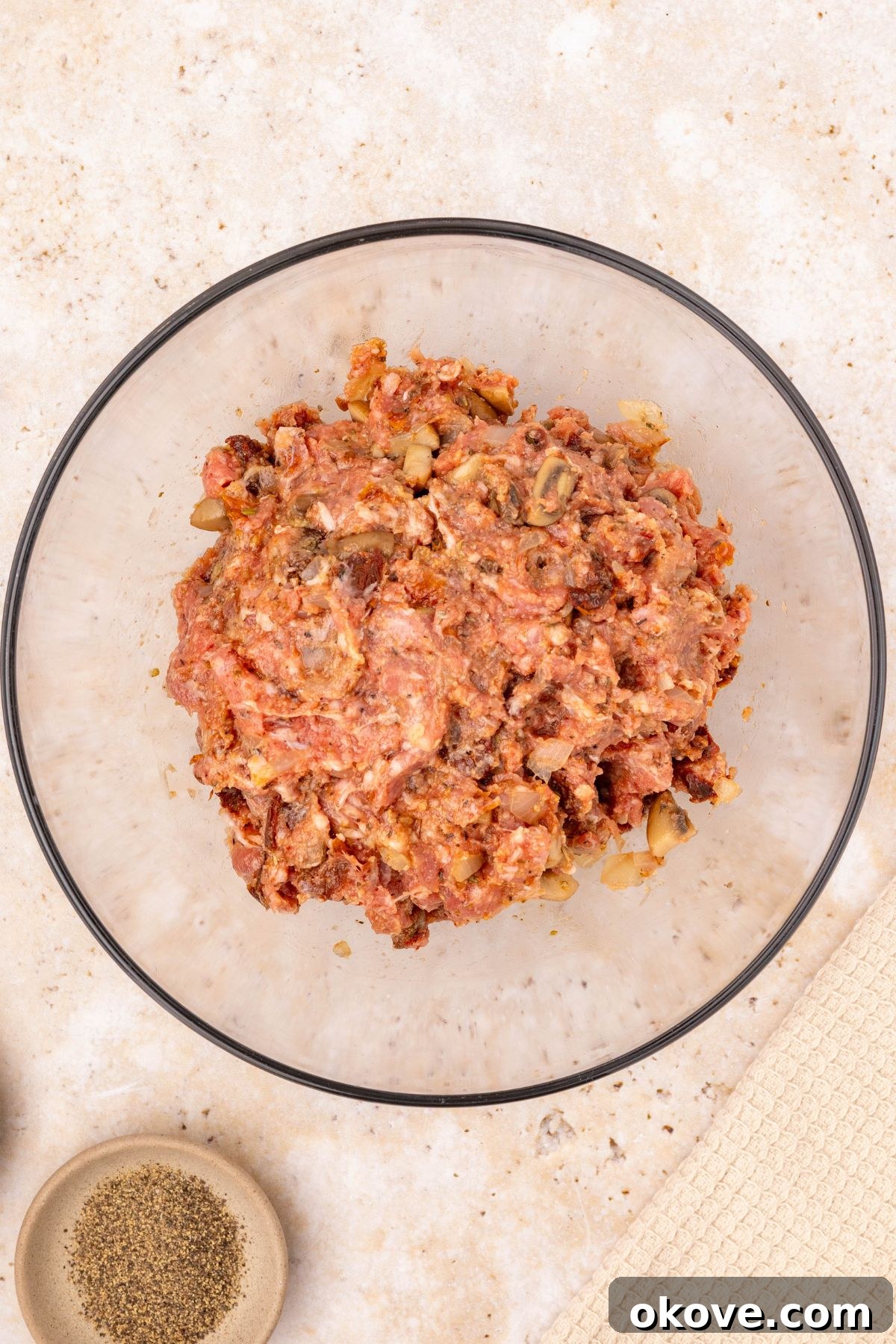 Classic Italian Meatloaf 7 Uncooked meat mixture shaped into a neat oval loaf, placed in an oval casserole dish, ready for sauce.