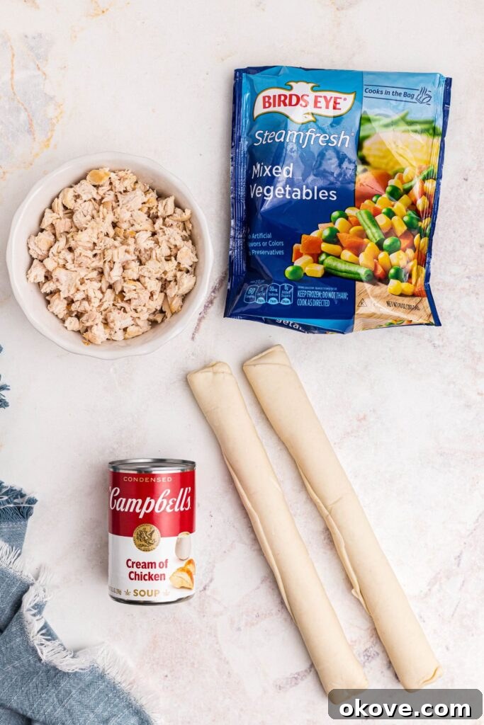 Quick and Cozy Chicken Pot Pie 3 All the ingredients needed to make easy chicken pot pie laid out on a marble table.