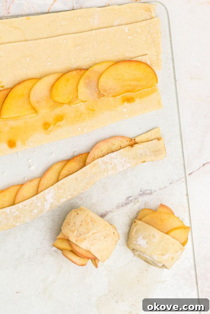 Baked Apple Blooms 7 Slices of apples over apricot jam on puff pastry slices, then rolled up, making roses.