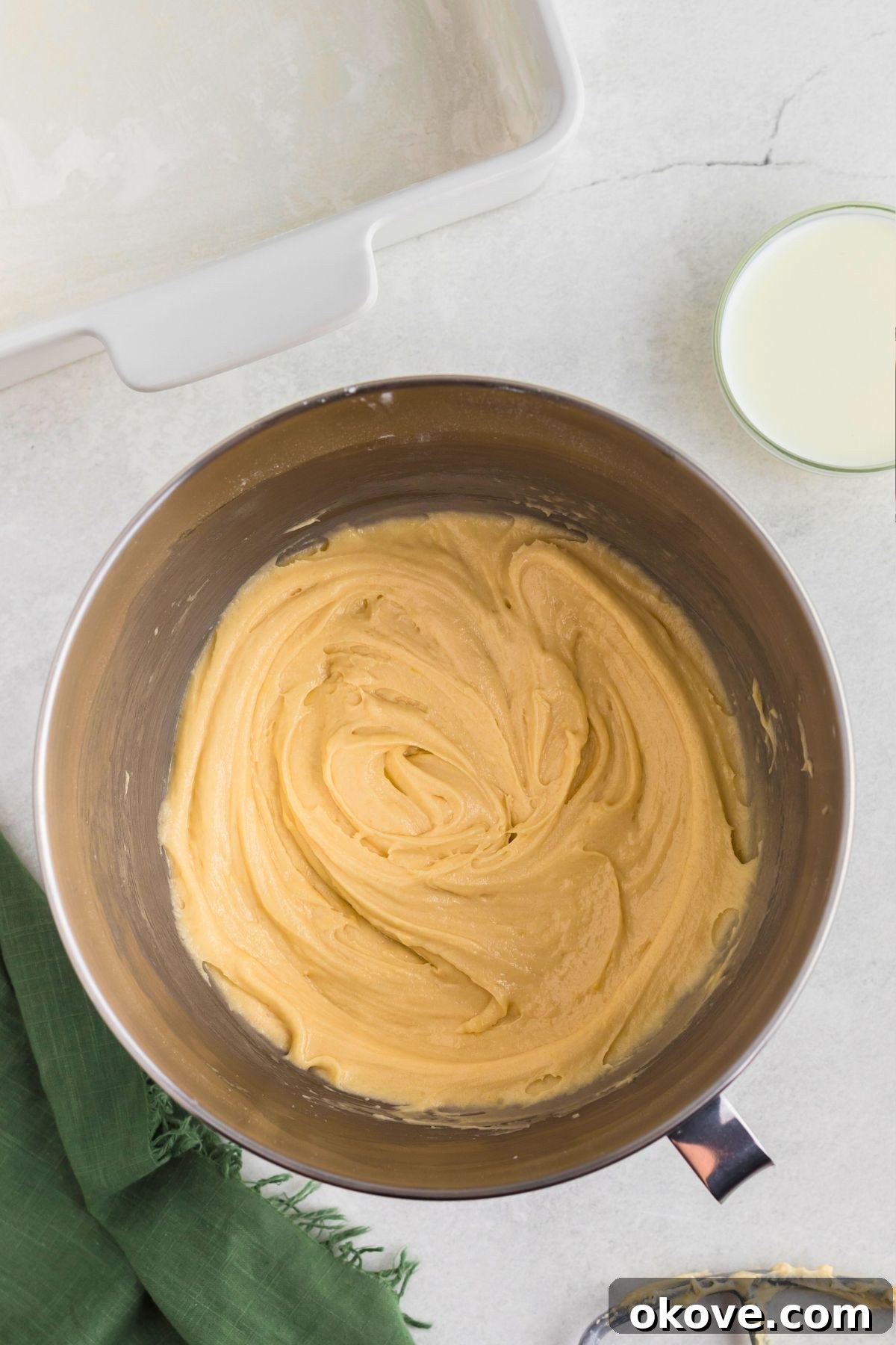Buttery Bliss Cake 5 Butter cake batter mixed in a silver bowl.
