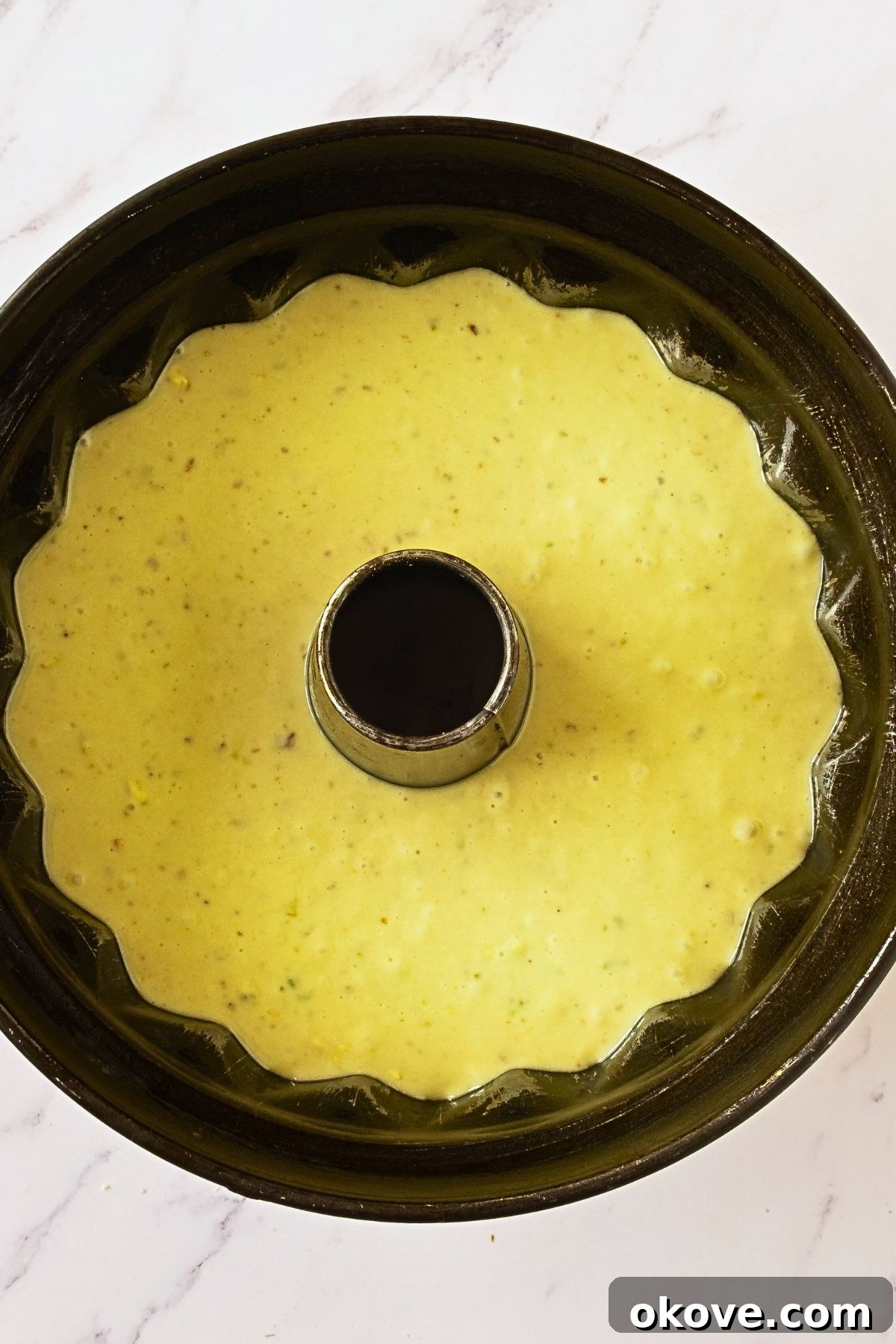 Emerald Pistachio Bundt 6 Pistachio cake mix in a Bundt cake before being baked.