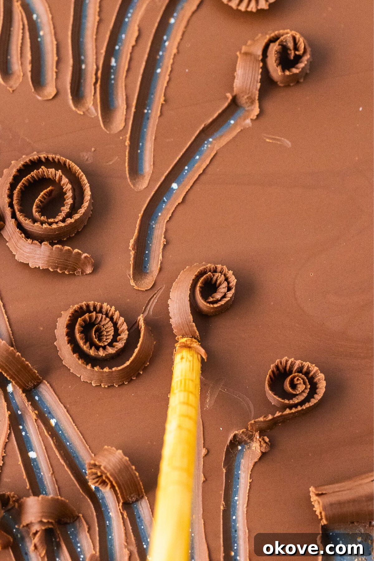 The Secret to Perfect Chocolate Curls 5 Chopstick being used to make small skinny curls.