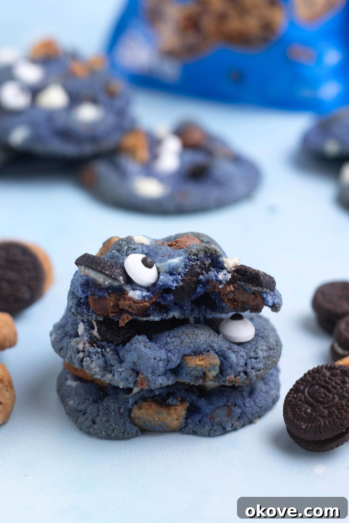 Blue Monster Munchies 9 Bright blue cookie monster cookies stacked on a blue table.