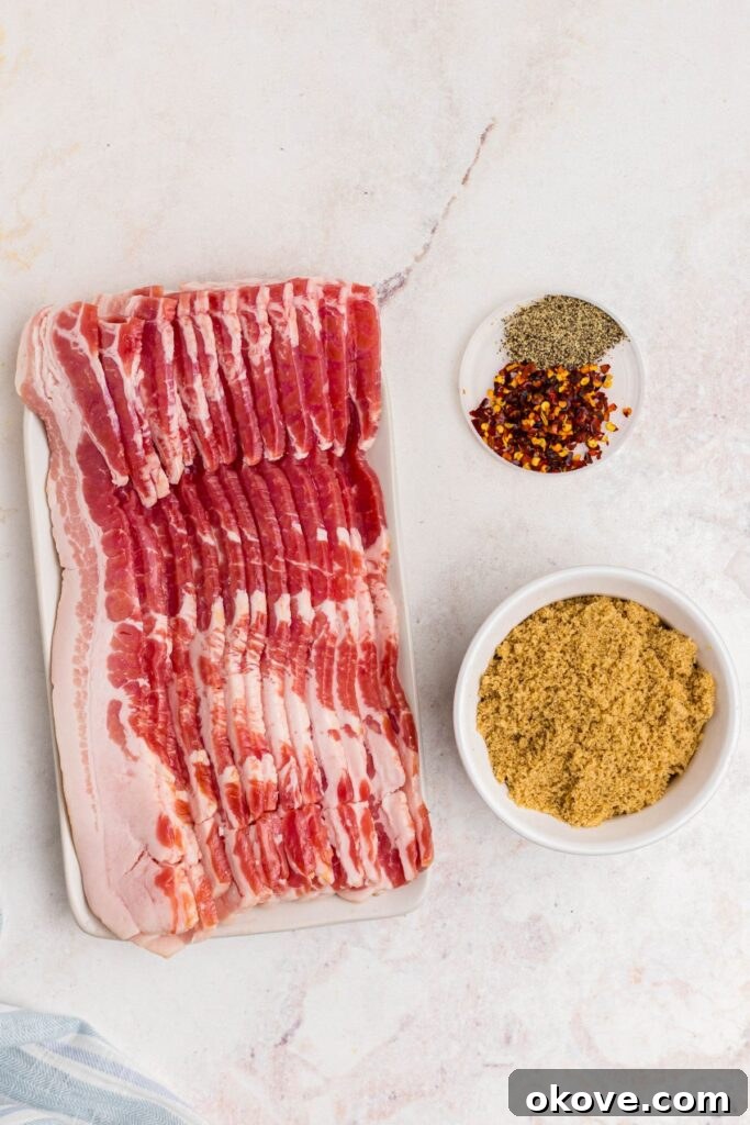 Decadent Caramelized Bacon 3 Bacon and seasonings on a marble table before cooking.