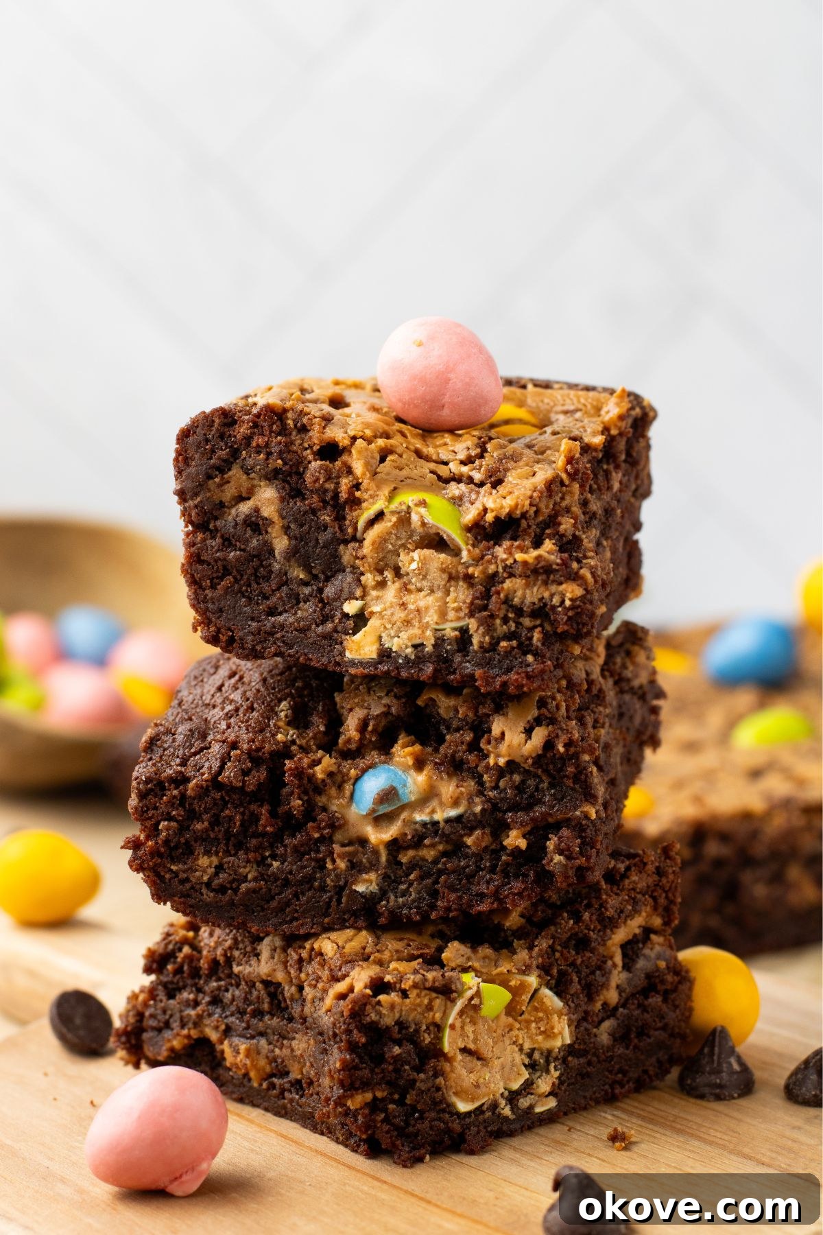 Chocolate and peanut butter Easter brownies stacked on the table after being cut into slices.