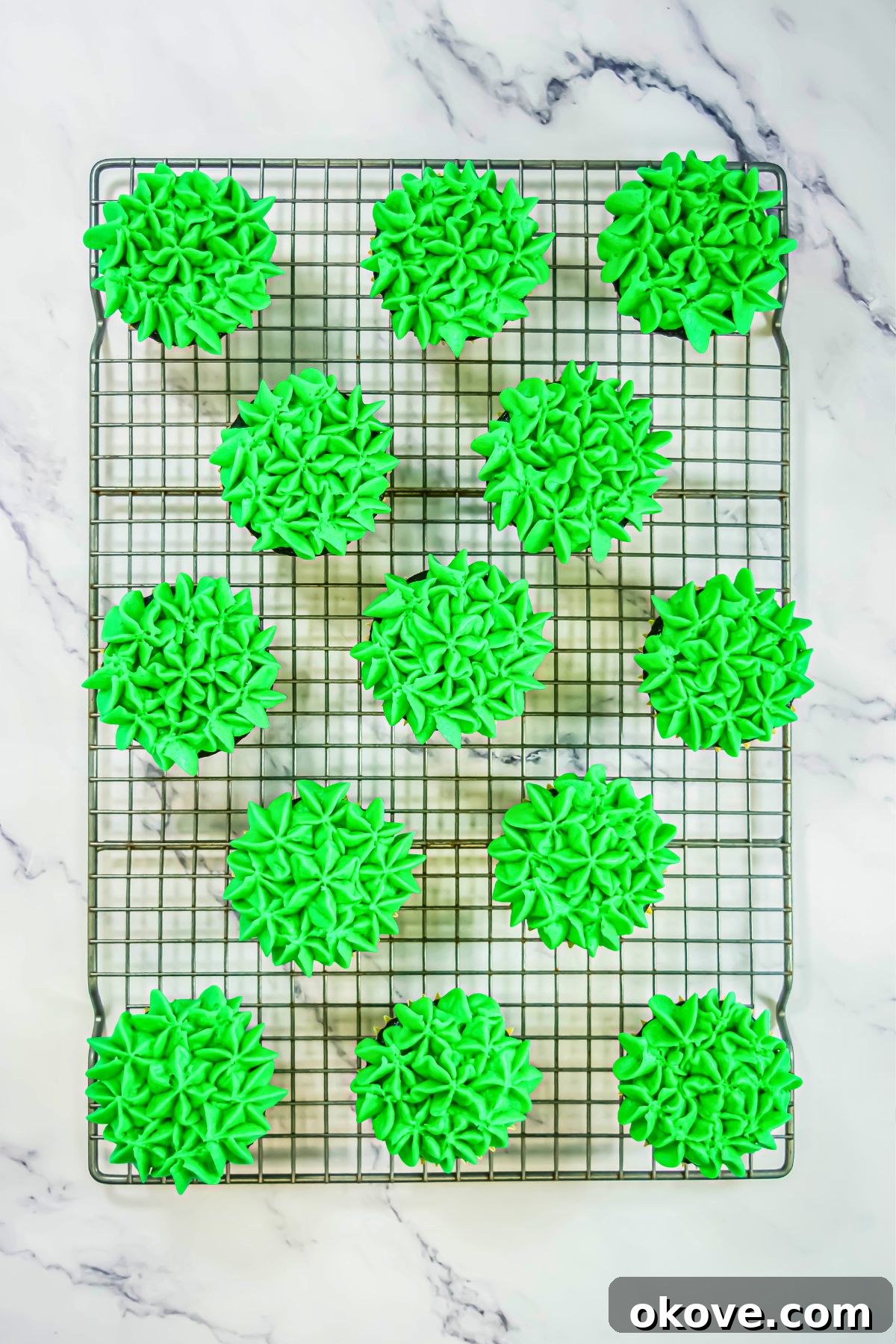 Colorful Peeps Cupcake Delights 8 Delicious chocolate cupcakes beautifully frosted with green buttercream, awaiting their Peeps decorations.