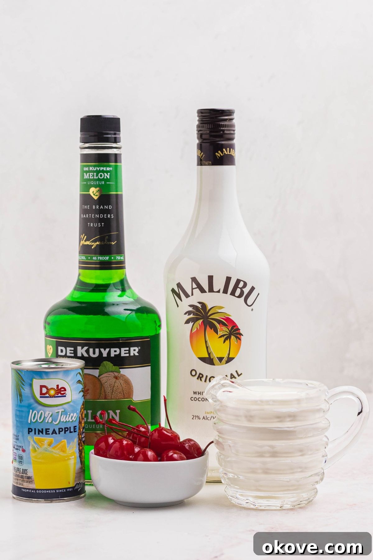 Ingredients needed to make scooby snack shots on a marble table. 