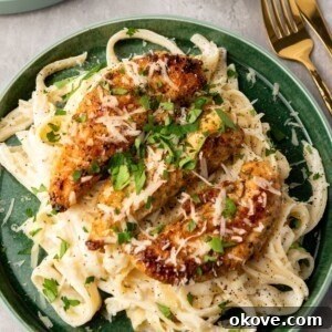 Golden seasoned chicken on top of fettuccine tossed with alfredo sauce.