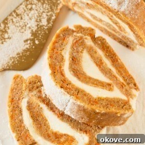 Golden, moist carrot cake rolled and filled with frosting.