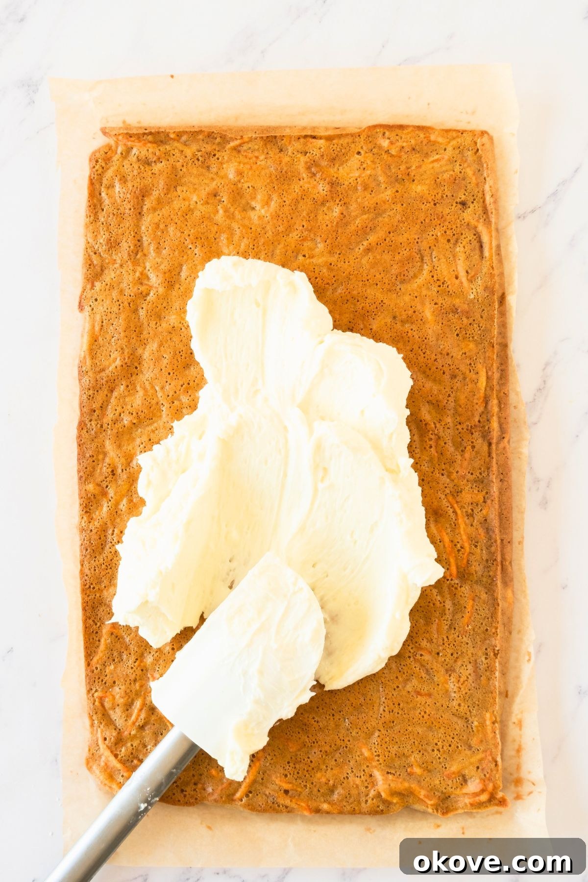Spiced Carrot Roulade 6 Warm carrot cake freshly baked, being carefully rolled with a clean kitchen towel to cool.