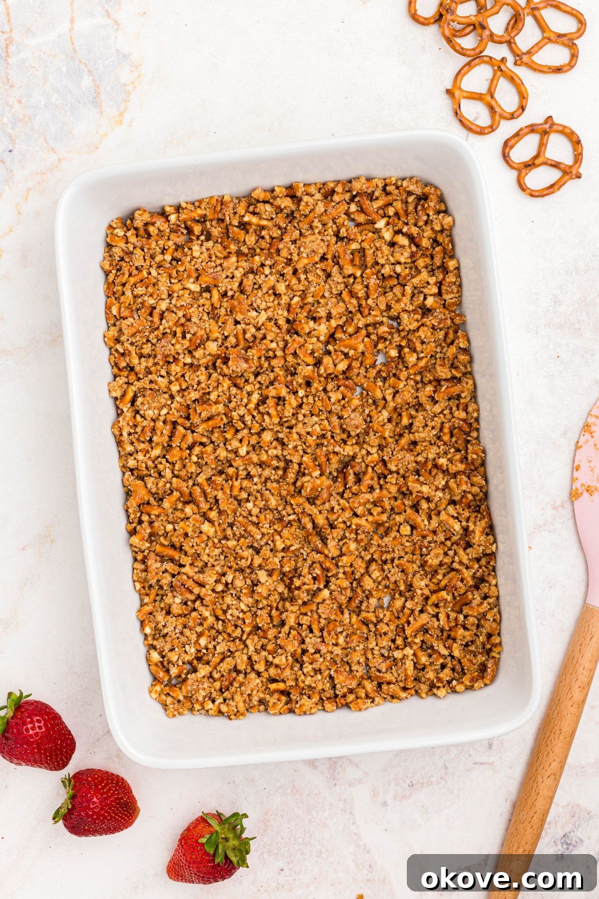 Strawberry Pretzel Dream 6 Crushed pretzels with butter and sugar, spread into a 9x13 baking dish.
