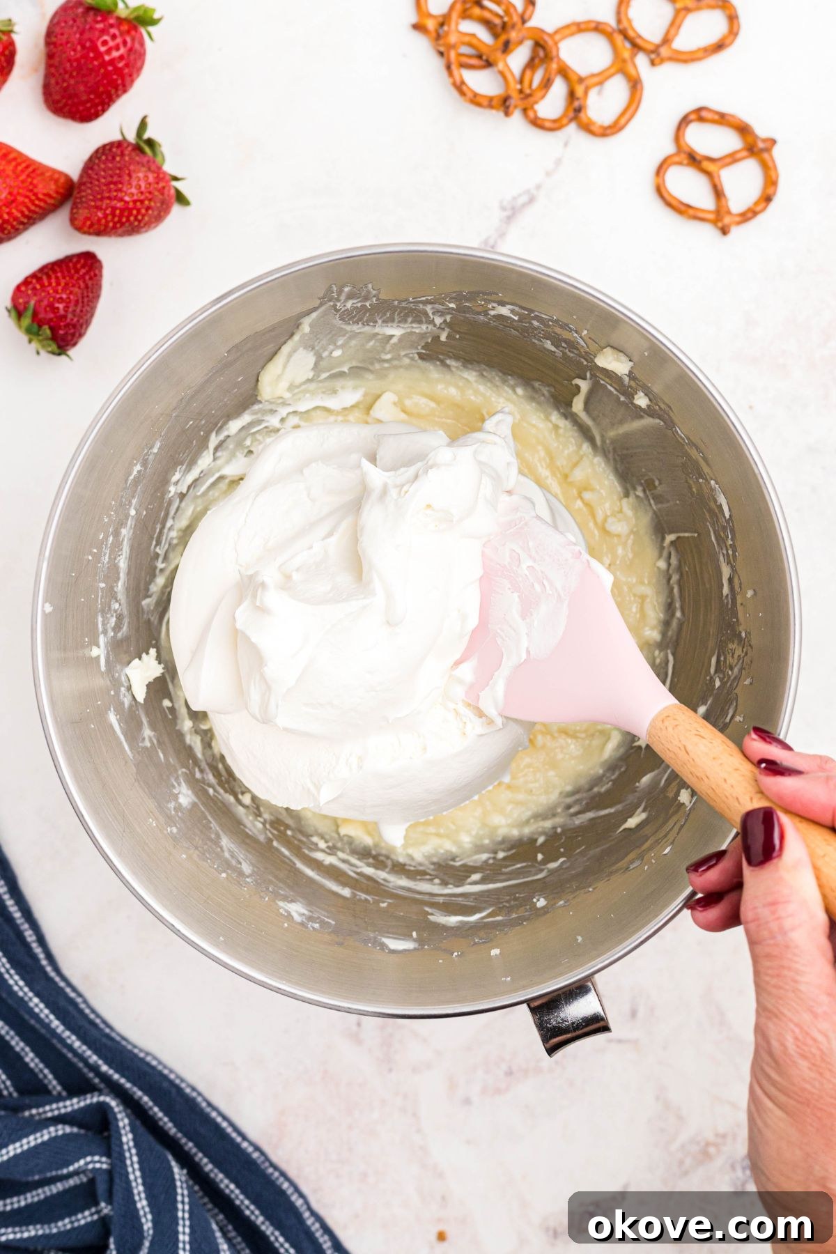 Strawberry Pretzel Dream 7 Cream cheese, sugar, and cool whip mixed together in a silver bowl.