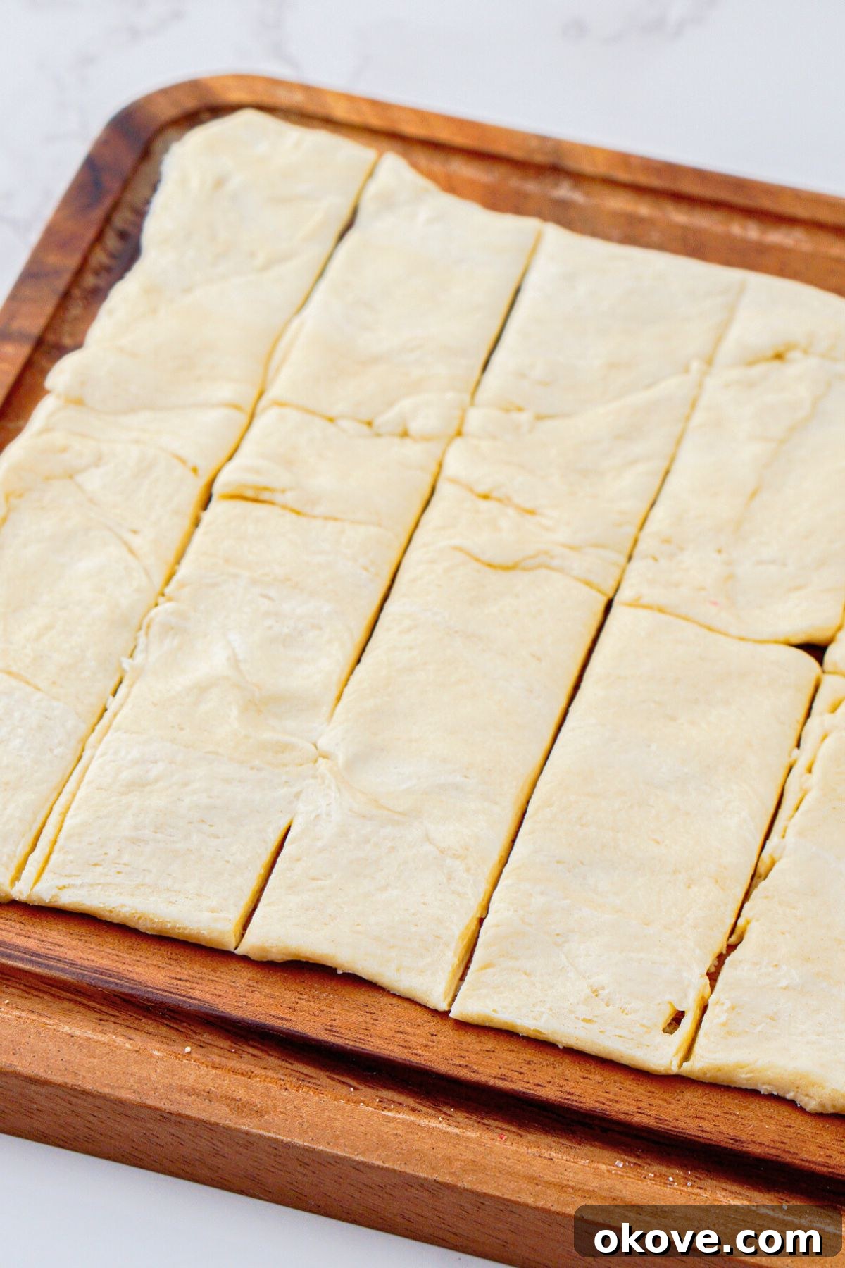 Canned crescent roll dough rolled out and cut into strips.