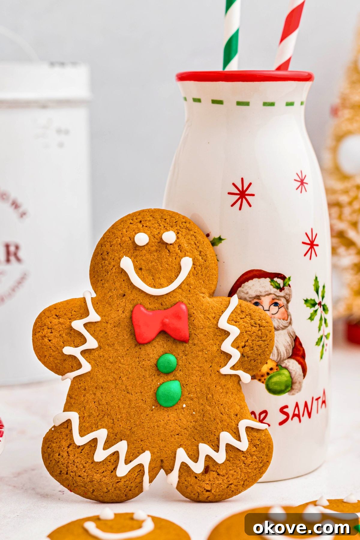 Festive Gingerbread Delights 12 Gingerbread man cookie leaning up against a bottle of milk.