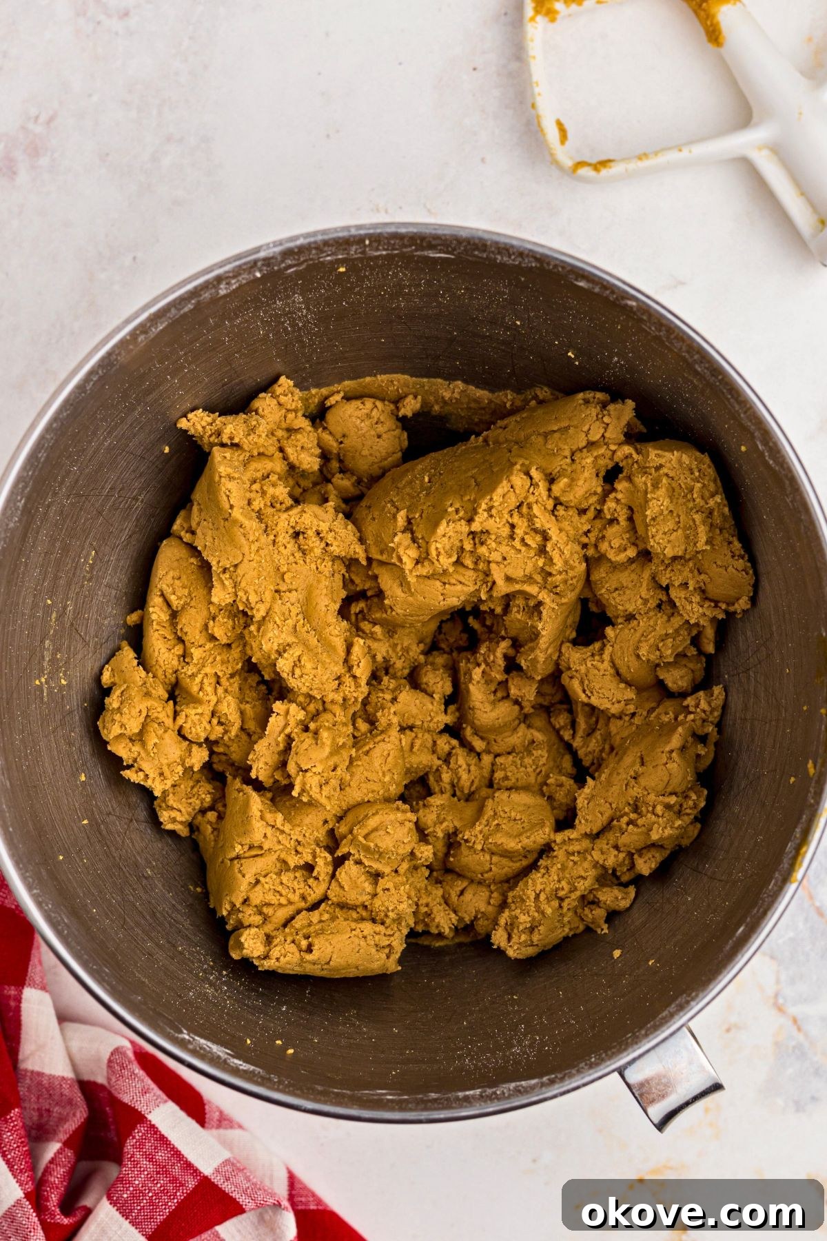 Festive Gingerbread Delights 6 Light and fluffy gingerbread cookie dough in a silver mixing bowl.