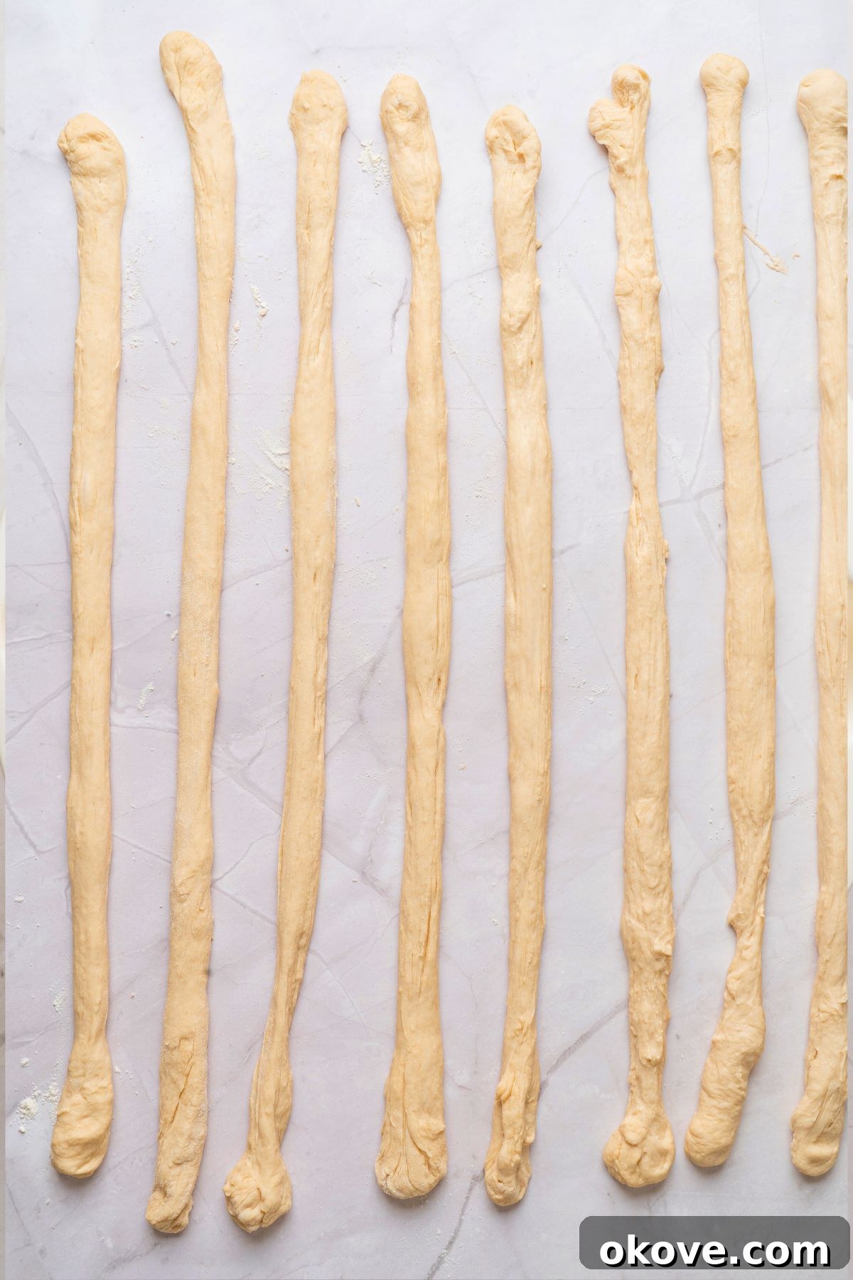 Pillowy Soft Pretzels 8 Pretzel dough divided into strips and rolled into 8 pieces, about 24 inches long.