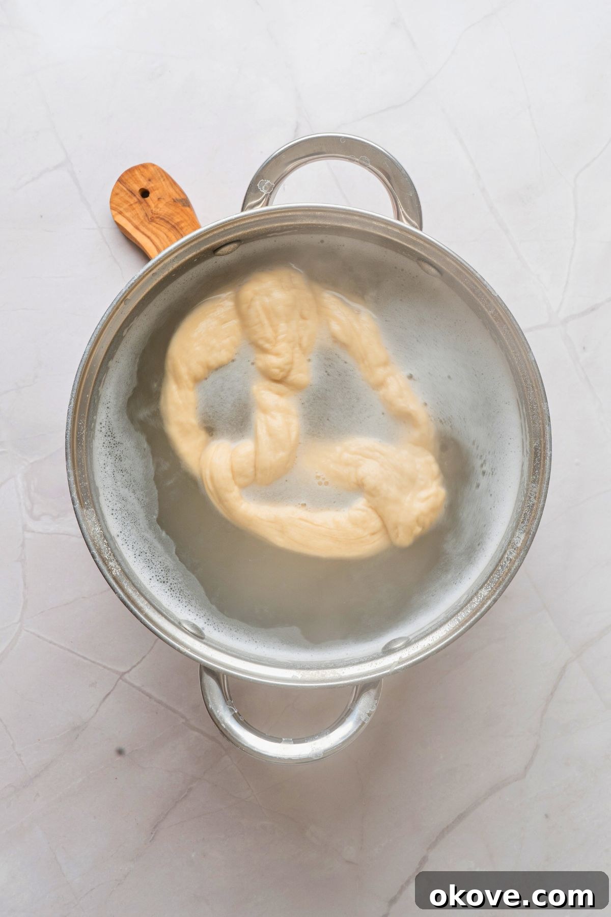 Pillowy Soft Pretzels 10 Pretzels being boiled in baking soda water bath before being baked.