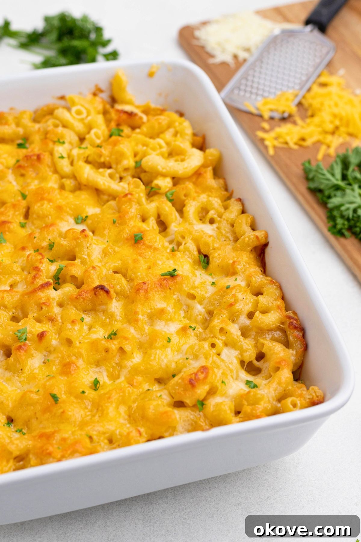 Golden Baked Mac 2 Creamy mac and cheese after it has been baked, in a white casserole dish, showing a golden top.