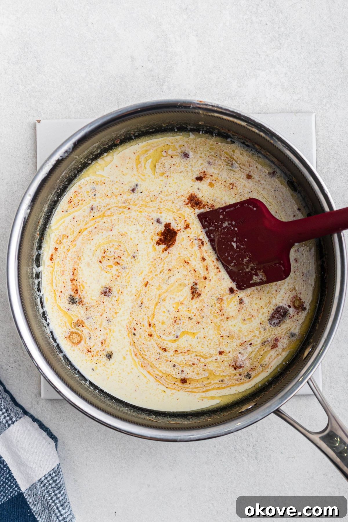 Golden Baked Mac 5 Heavy cream, butter, and seasonings, mixed together in a saucepan.