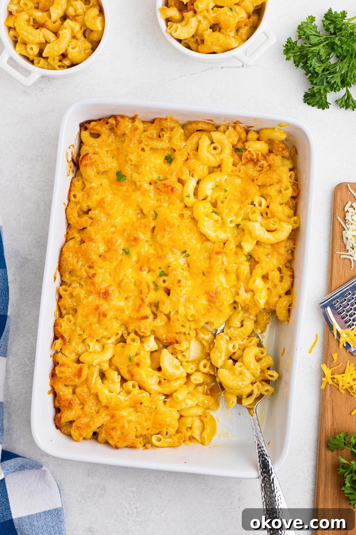 Golden Baked Mac 8 Creamy mac and cheese after it has been baked, in a white casserole dish, ready to be served.