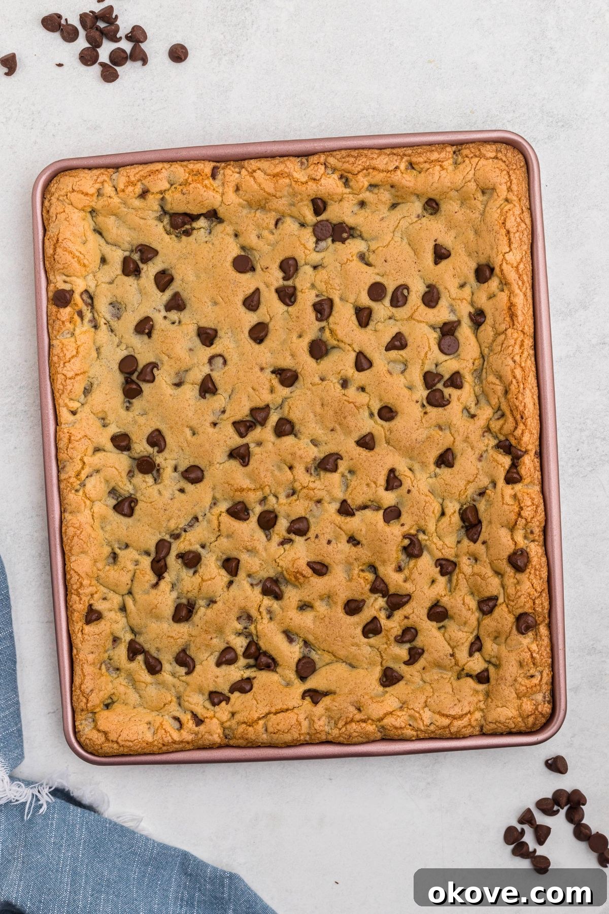 Ultimate Chocolate Chip Bars 9 Chocolate chip cookie dough baked until golden brown in a baking pan.