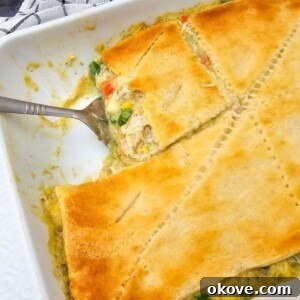 Homestyle Chicken Pot Pie Bake 11 Golden crusted chicken pot pie casserole in baking dish after baking in the oven.