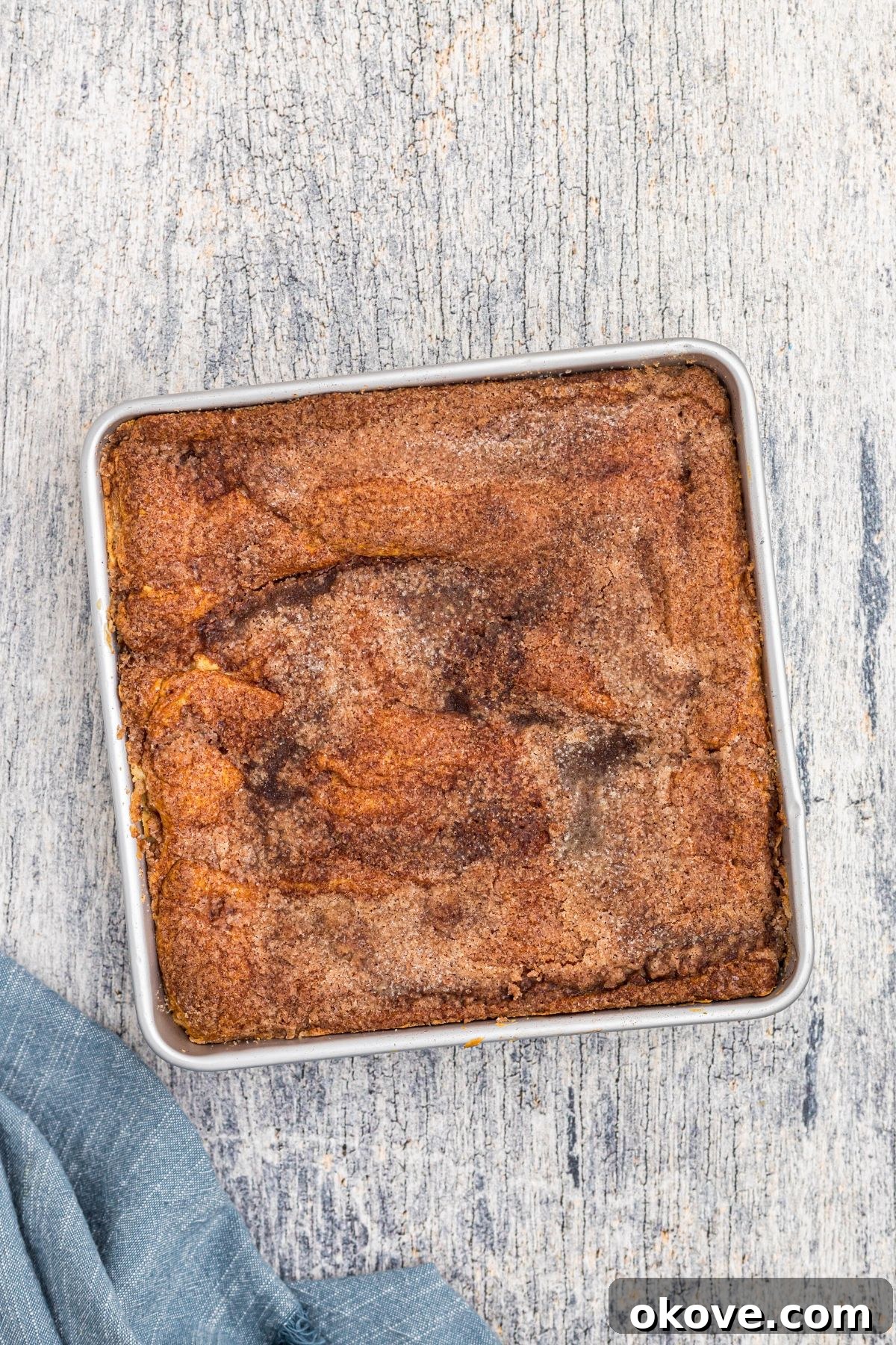 Cinnamon Sugar Crust Cheesecake 10 Baked cheesecake topped with crescent roll, melted butter, cinnamon and sugar.