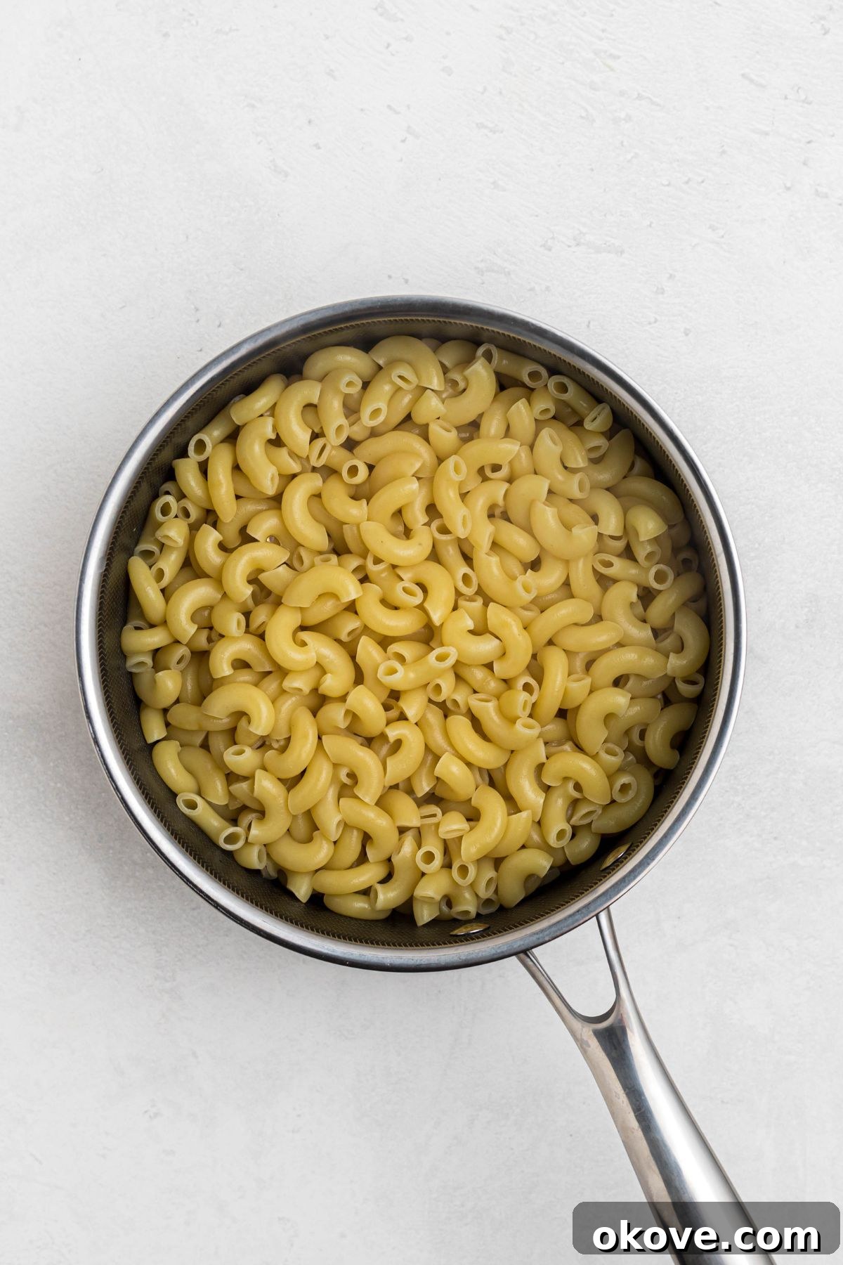 Ultimate Smoked Macaroni and Cheese Bake 4 Macaroni lightly cooked in a saucepan.