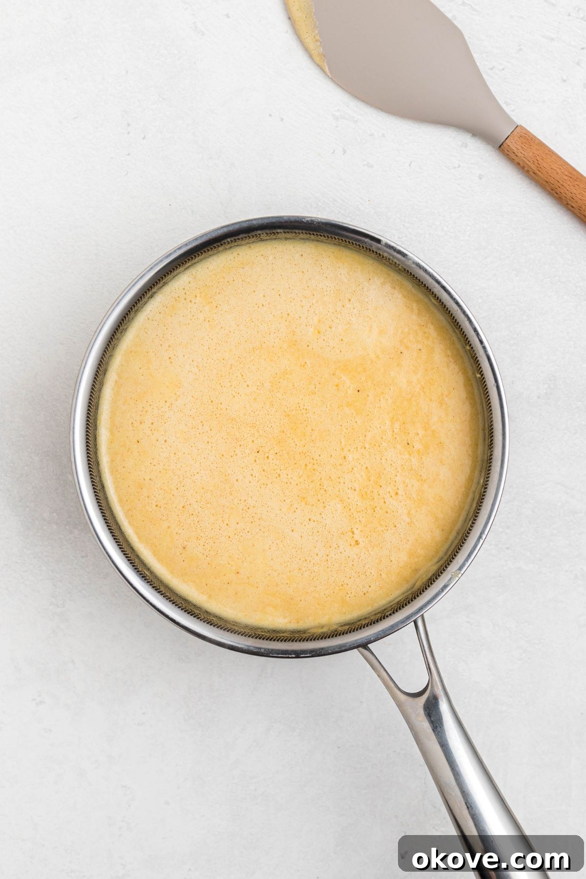 Ultimate Smoked Macaroni and Cheese Bake 6 Melted cheeses, mixed with milk, cream, and seasonings, in a medium saucepan.