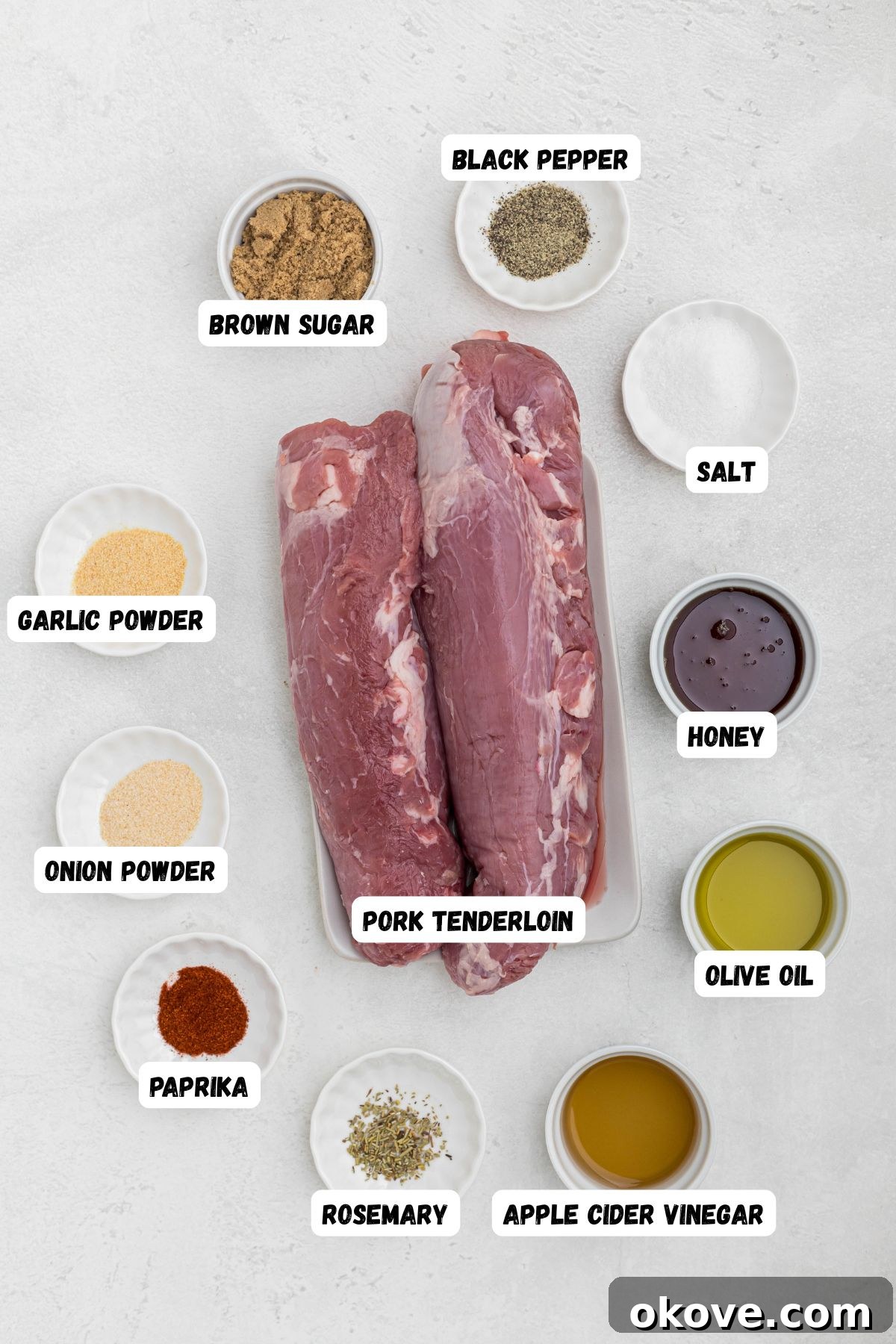 Smoky Pork Tenderloin Perfection 3 Ingredients measured into small bowls and labeled on a white marble table, ready for mixing to create the perfect rub and glaze for smoked pork tenderloin.