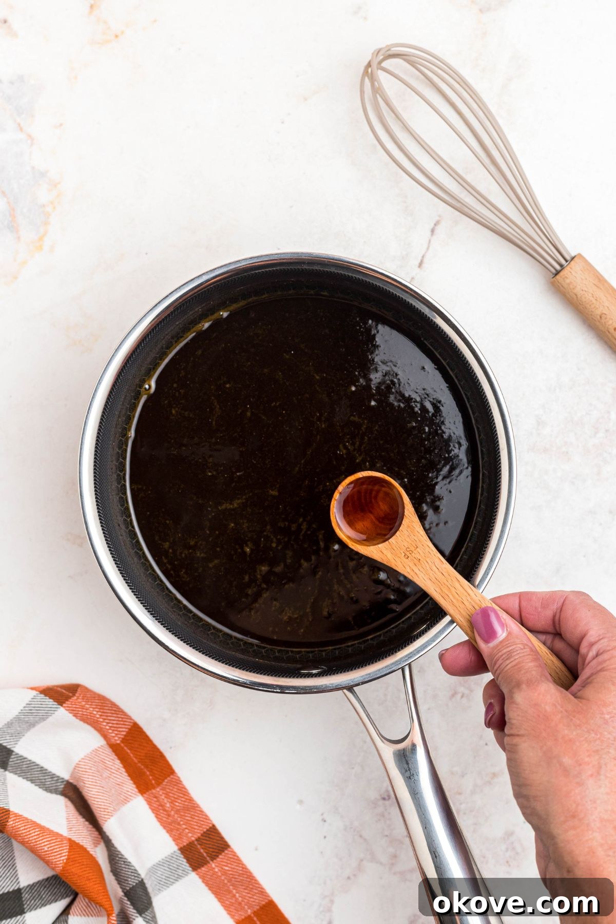 Golden Autumn Elixir 6 Vanilla extract being added to saucepan.