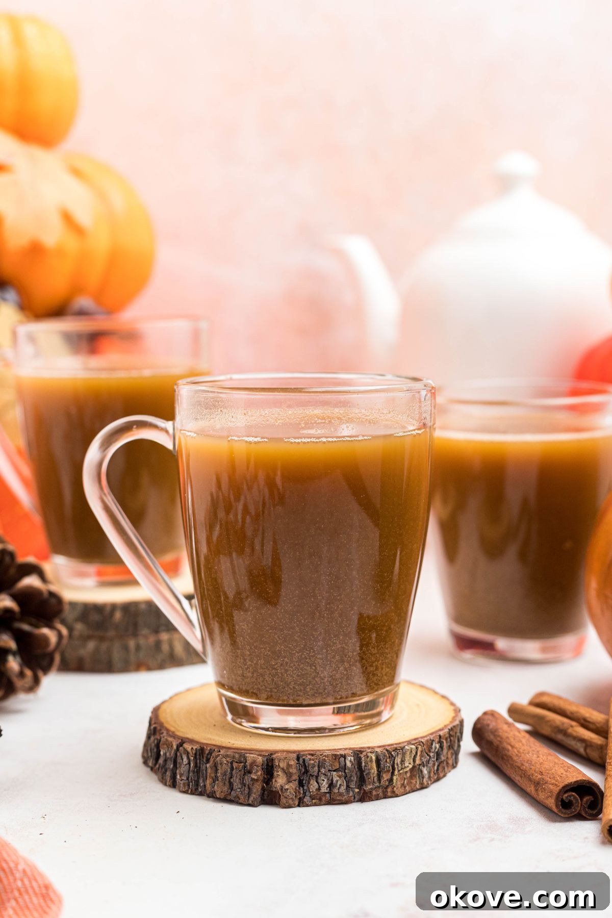 Cozy Pumpkin Spice Brew 6 Clear glass mug filled with hot coffee and pumpkin spice mixture, showcasing the rich color.