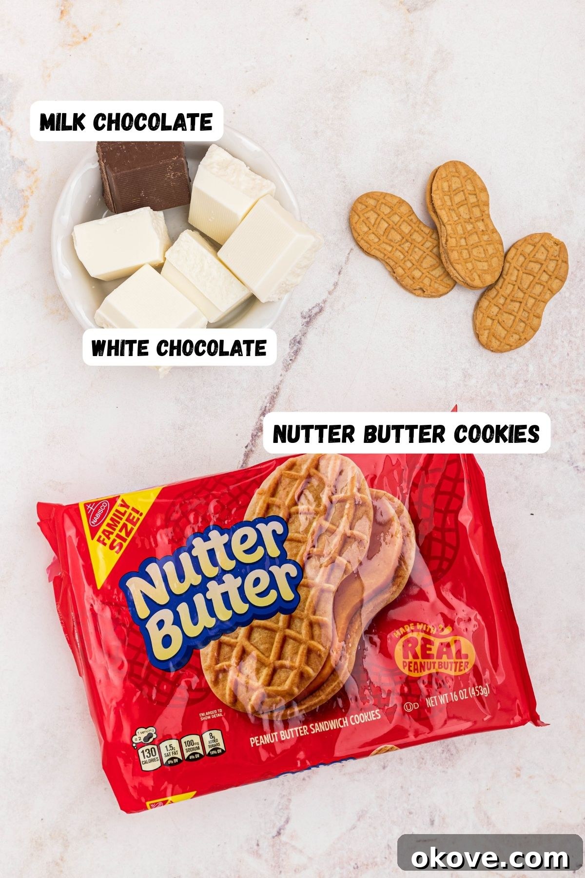 Nutter Butter Boo-tiful Bites 3 Package of cookies with small bowl of chocolate and white chocolate melting chocolate in white bowls on a marble table.