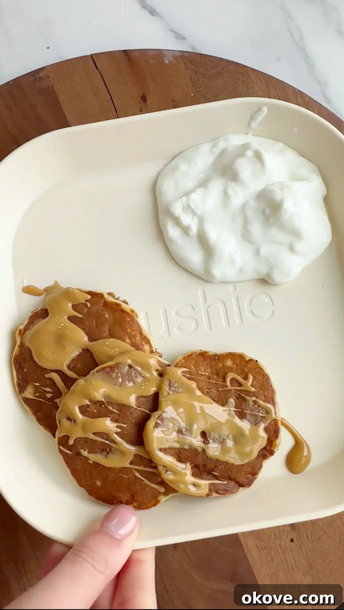Effortless 3-Ingredient Pancakes 2 Close-up of fluffy 3-ingredient banana pancakes with peanut butter and yogurt, perfect for baby-led weaning.