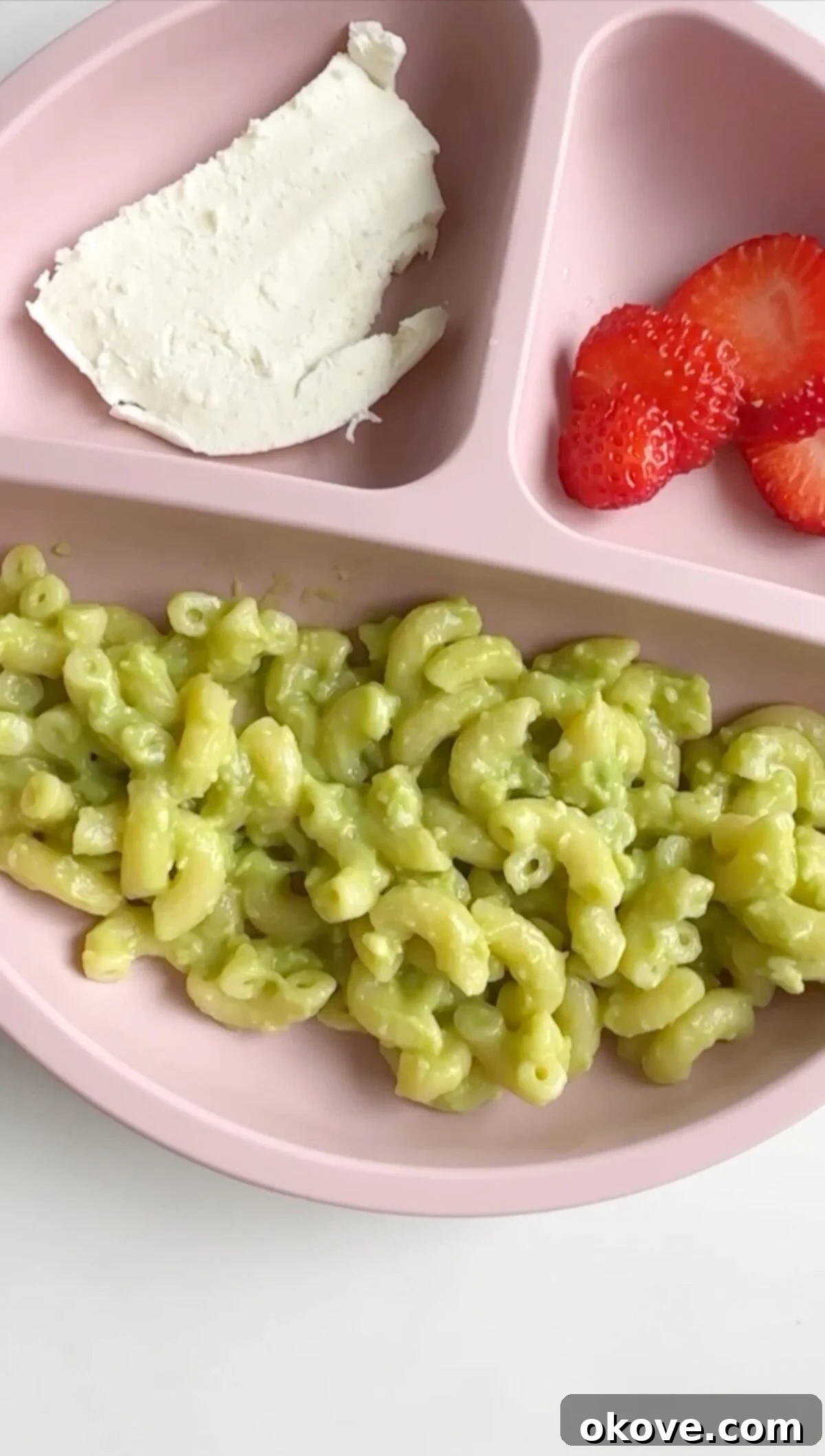 Velvet Avocado Pasta 2 Avocado pasta in a divided plate with sliced strawberries and mozzarella cheese