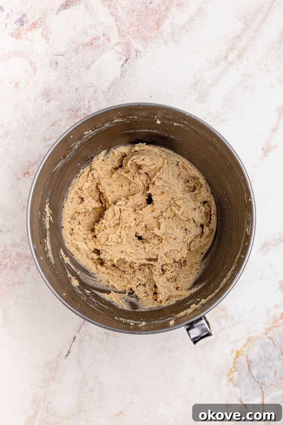 Powdered Cloud Kisses 5 Snowball cookie dough, mixed together in a silver bowl, ready for chilling.