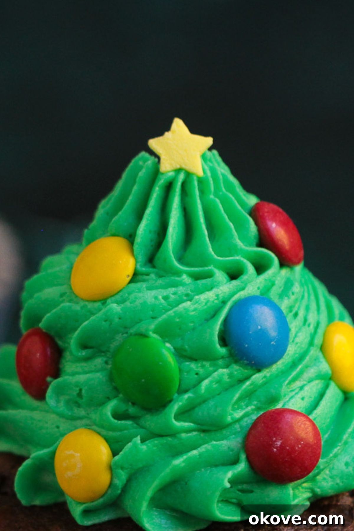 Edible Christmas Trees 7 Candy star sprinkles used as tree toppers on frosting trees.