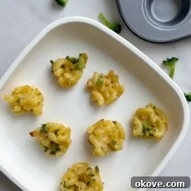 Broccoli mac n cheese bites arranged on a plate, ready to be enjoyed.