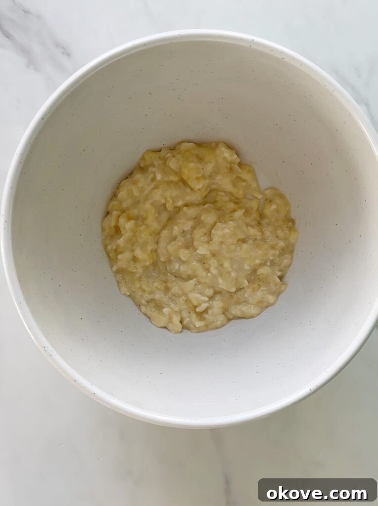 Golden Carrot Banana Oat Delights 3 Freshly baked banana carrot oat cookies on a wire rack, cooling down.