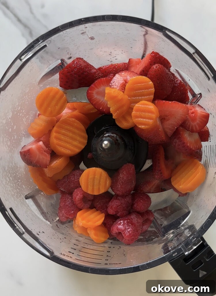 All ingredients in a blender, ready to be pureed into a smooth mixture.