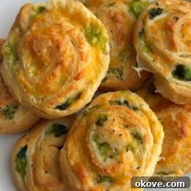 Delicious broccoli cheese pinwheels on a white plate
