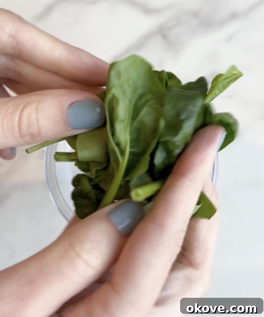 Guilt-Free Fudge Pops 3 Close-up of fresh spinach leaves, a key ingredient for healthy fudgesicles, ready to be blended.
